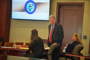 Kimberle Weeks, right, with her attorneys Kevin Kulik and Ashley Kay today. Click on the image for larger view. (© FlaglerLive)