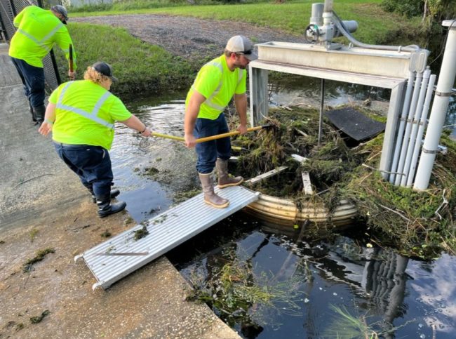 Palm Coast crews cleaning a weir, a water-control structure, after Hurricane Milton. (Palm Coast)