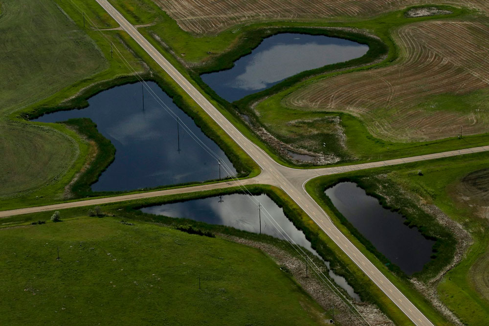 Roads divide what once was a larger wetland into four smaller pools in east-central North Dakota.