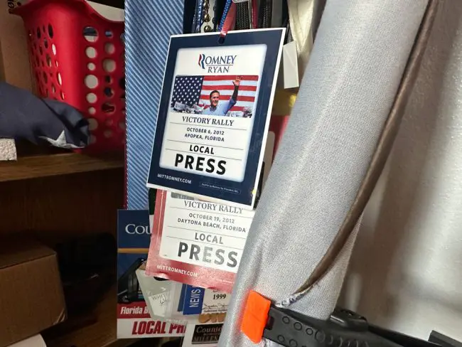Jason Wheeler's souvenir press passes, kept in a corner of his office at the district. (© FlaglerLive)