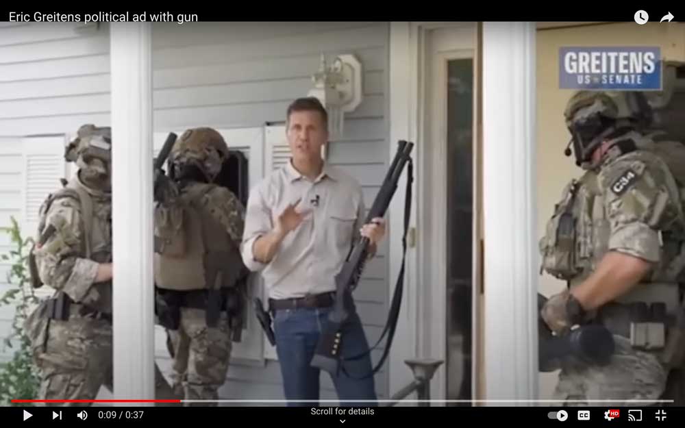 Eric Greitens poses with a high-powered rifle and commandos in a political ad. (Eric Greitens)