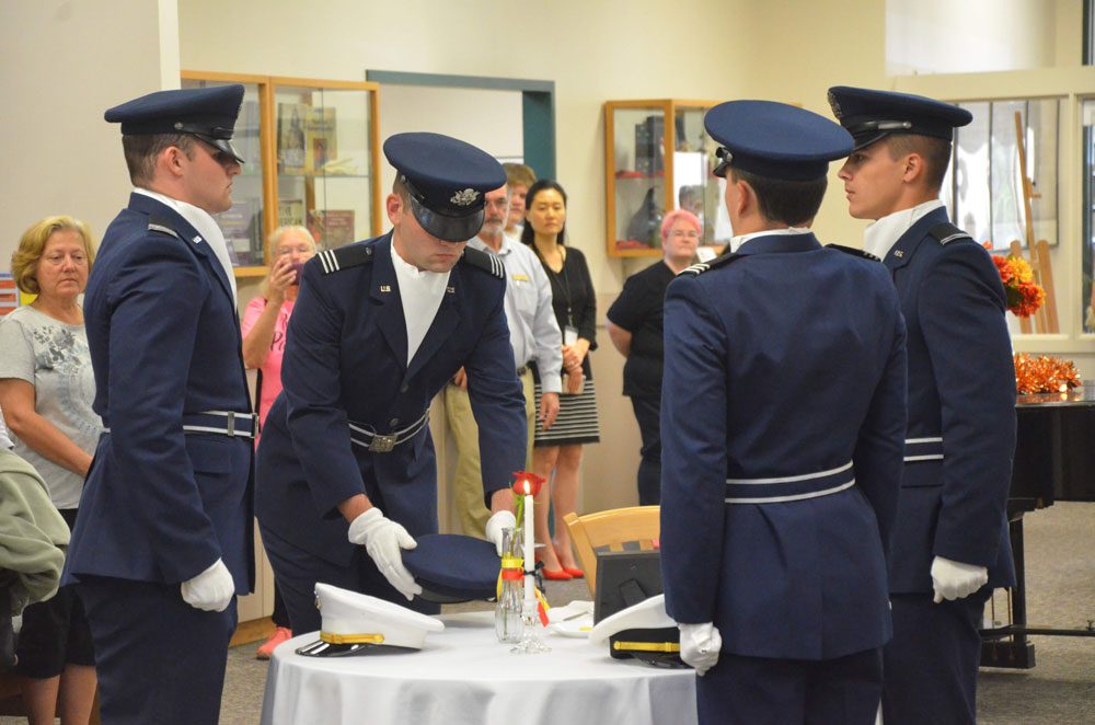 The Flagler County Public Library on Saturday (Nov. 9) hosted a White Table ceremony in remembrance of service members lost in wars. The ceremony was led by an ROTC detachment from Embry-Riddle Aeronautical University. (© FlaglerLive)