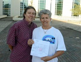 Michele Villa, right,  Dawn Wilcox and their marriage license, just filled out at the Flagler County Courthouse Tuesday morning. Click on the image for larger view. (© FlaglerLive)