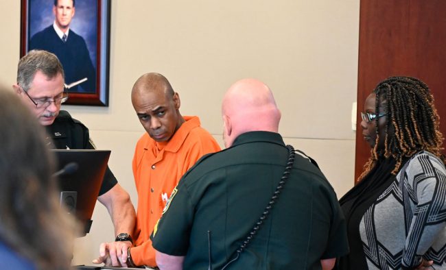 Leon Wiley as he was being fingerprinted, a requirement of state prison procedures whenever a person is sentenced of a felony. (© FlaglerLive)