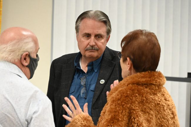 Flagler Beach City Manager William Whitson, speaking with Jane Mealy before the forum, attended the session at the Flagler Woman's Club. (© FlaglerLive)