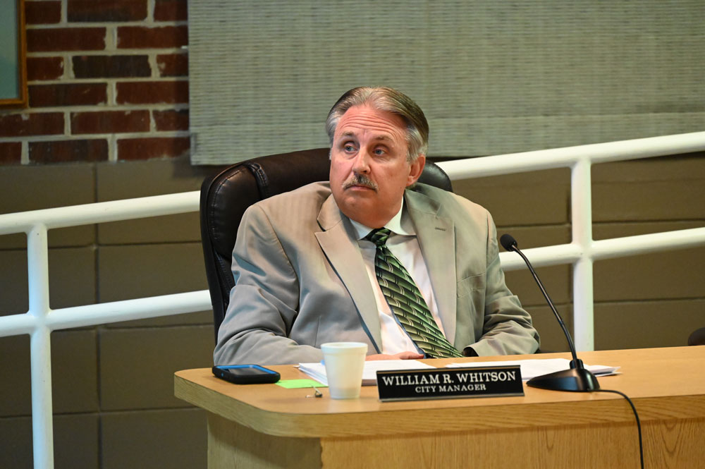 Flagler Beach City Manager William Whitson had to answer uncomfortable questions about July 4 plans at Thursday's Flagler Beach City Commission meeting. (© FlaglerLive)