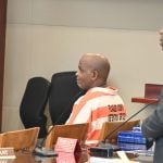 Jermaine Williams in a pre-trial appearance, with his attorney, Junior Barrett, to the right. Williams's trial on a capital murder charge begins Monday. (© FlaglerLive)