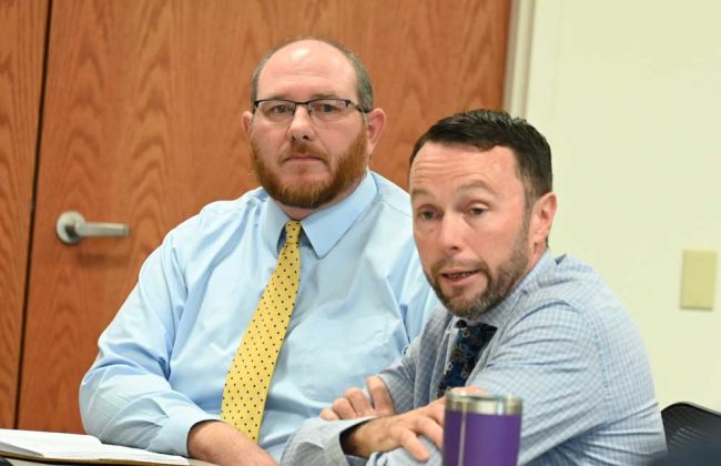 Chris Wilson, the attorney representing the Flagler County School Board on ILA issues, and Sean Moylan, in the foreground, the deputy county attorney. (© FlaglerLive)