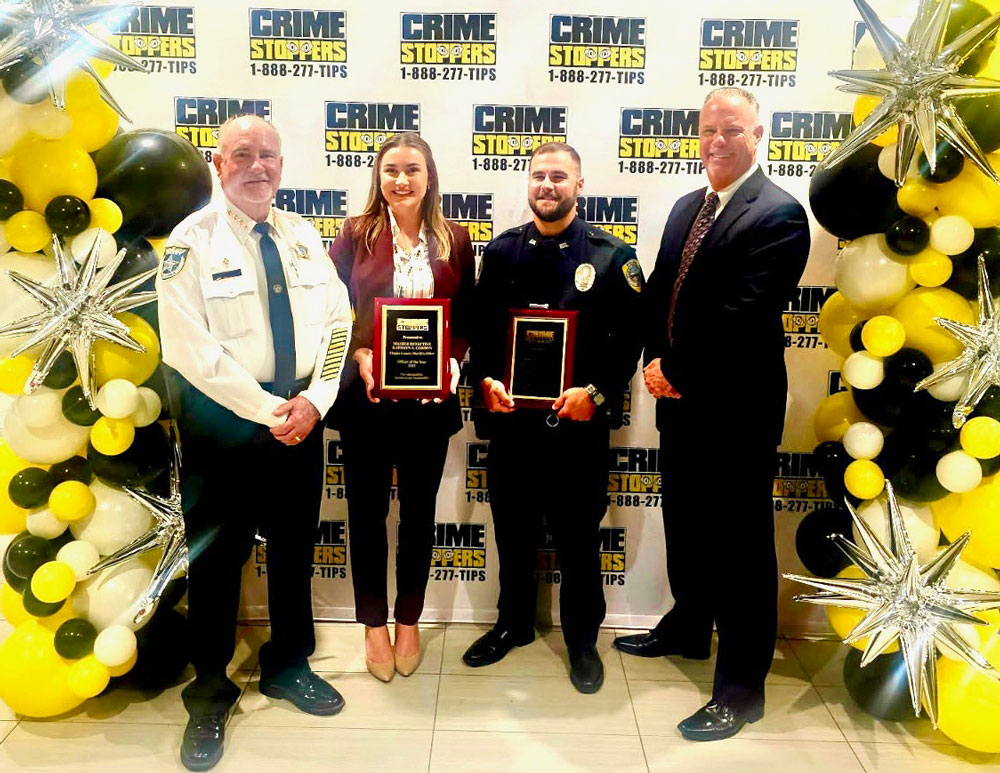 From left, Flagler County Sheriff Rick Staly, Master Detective Kathryn Gordon, Flagler Beach Police Officer Michael Snyder, and Flagler Beach Police Chief Matt Doughney. (CrimeStoppers)