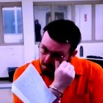 Brian Scott Wirth reading his statement for 20 minutes today from a jail room, before he was sentenced to life in prison. (© FlaglerLive)
