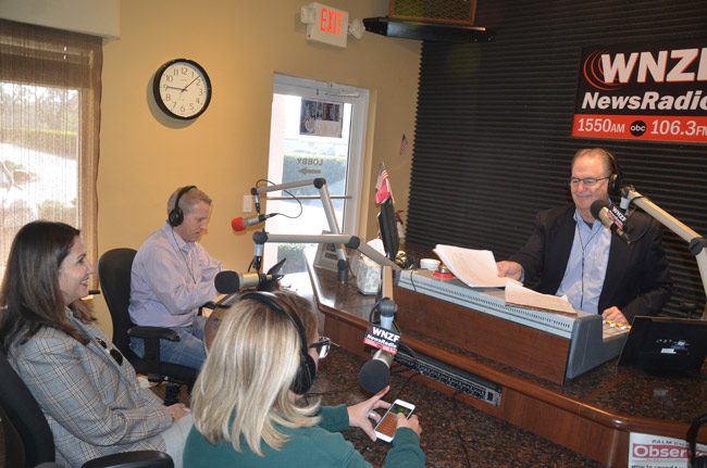 The Palm Coast administration's 'alternative' proposal would still have council members appearing on a local radio show, as was the case with Mayor Milissa Holland, above, with Rep. Paul Renner, on David Ayres's Free For All Friday on Feb. 24, but would drop the infomercial approach of a weekly show and focus instead on a free podcast. (© FlaglerLive)