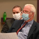 Defense attorney Garry Wood in the foreground with his client, Keith Johansen, as they went over the final list of jurors this afternoon. (© FlaglerLive)