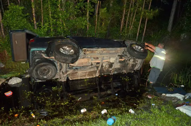 The Toyota was in a ditch in knee-deep water. Click on the image for larger view. (© FlaglerLive)
