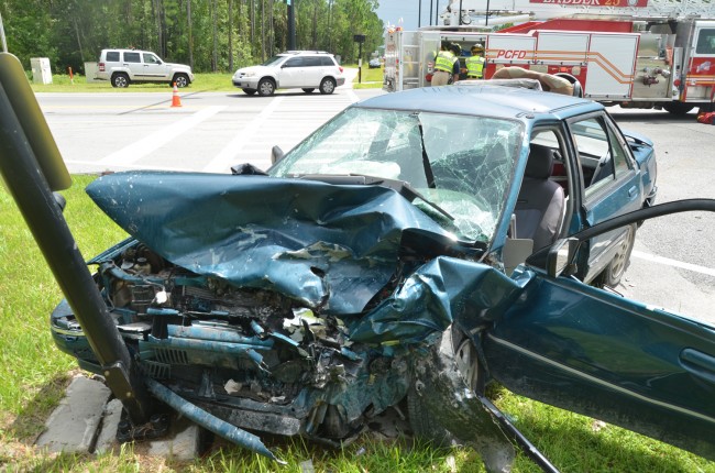 The Mercury was struck by the Ford before it struck a warning pole. Click on the image for larger view. (© FlaglerLive)