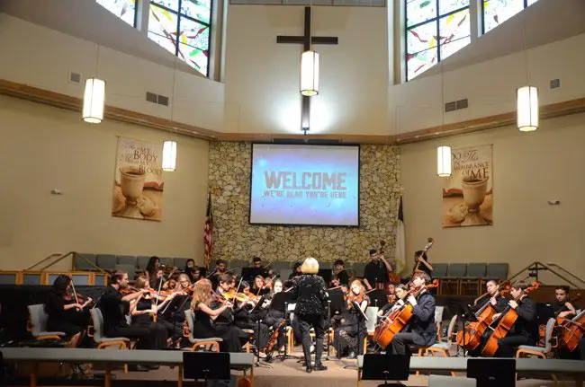 A concert series Palm Coast's First United Methodist Church includes events like the Flagler Youth Orchestra's top ensemble's annual performance in winter. No part of the event is religious in nature, though it takes place in the church's sanctuary. But the church's grant application drew questions regarding its 'outreach ministry' when the Palm Coast City Council discussed it this week. (© FlaglerLive)