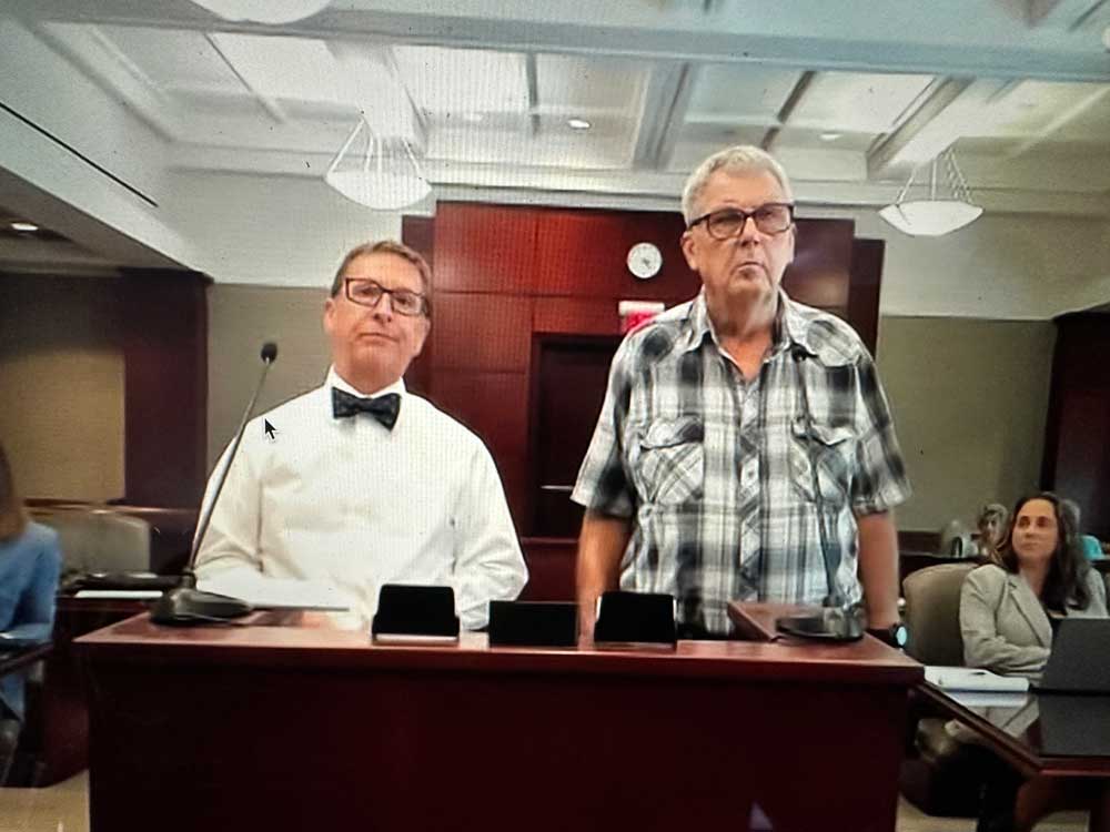 Lawrence Morton, right, with his attorney, Richard Zalesky. (© FlaglerLive via zoom)